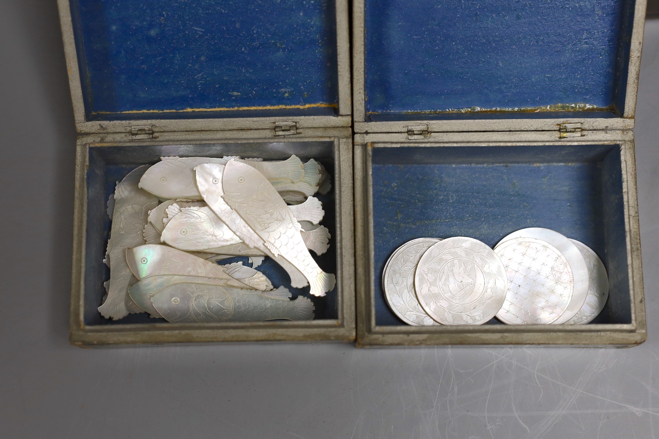 A 19th century Belgian stained sycamore box containing four counter boxes with named views, with mother of pearl fish shaped and circular gaming counters